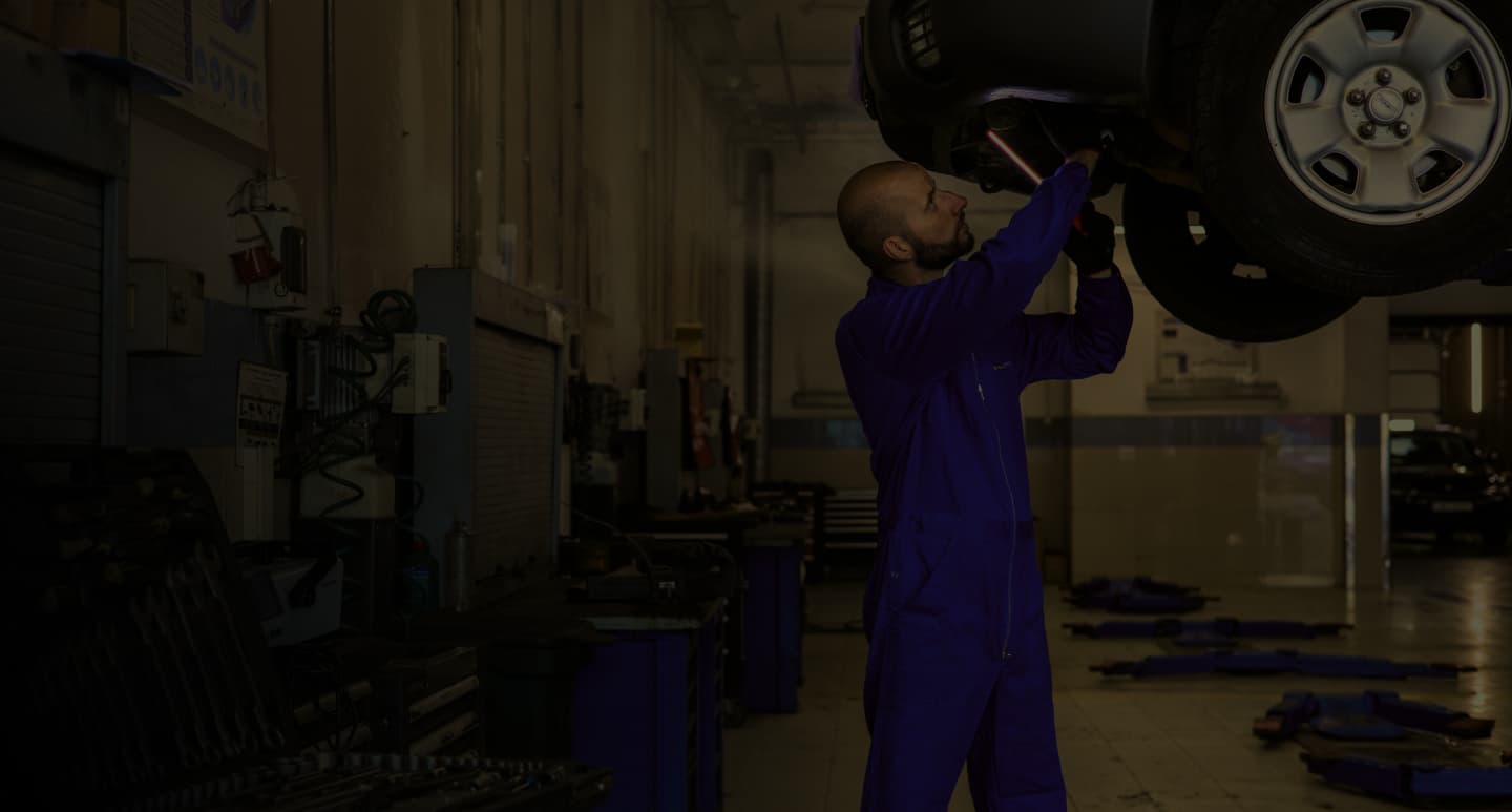 Mechanic working on car tire